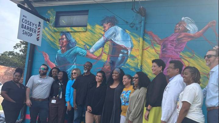 Mural promoting accessible cancer research unveiled on historic North Baton Rouge barbershop