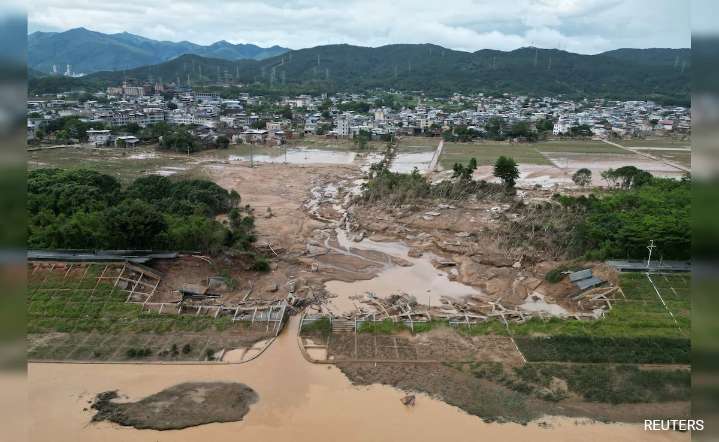 At least 12 dead as record rain floods in…..