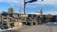 Ocala: Big rig driver unhurt; truck crashes onto its side