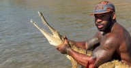 Popular US influencer facing fine for grabbing crocodile in Far North Queensland
