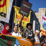 Photos show activists targeting billionaires in a street protest on the eve of New York Climate Week