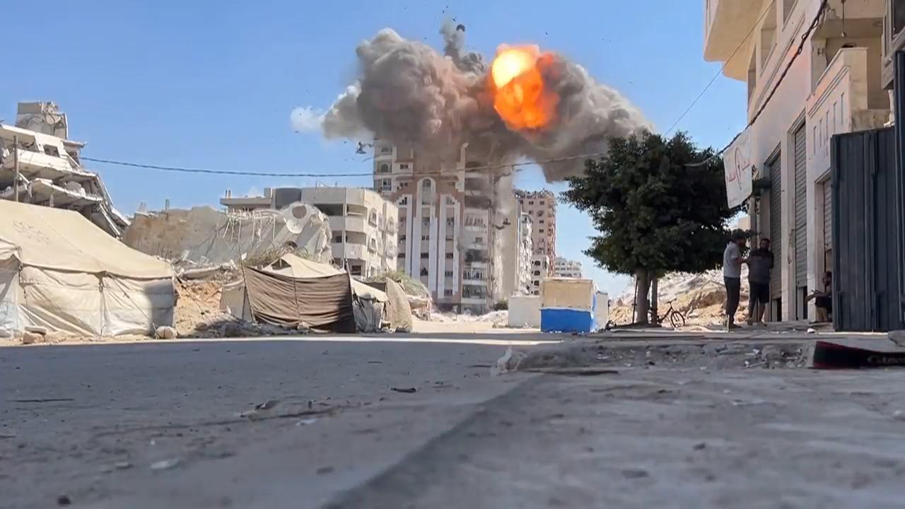 Israel’s military destroys multiple buildings in Gaza City, after warning residents to leave