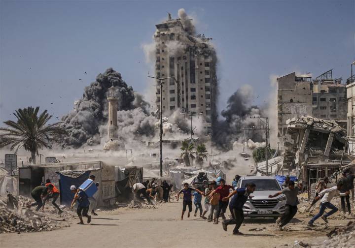 Israel strikes high-rise building and threatens to hit more in Gaza City offensive