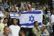Israel soccer coach ‘standing behind my country’ amid calls for squad to be suspended