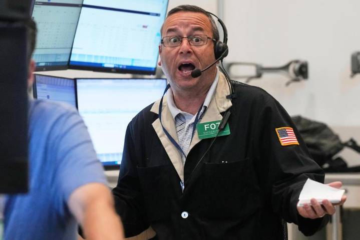 Stocks tick higher as Wall Street drifts near its record levels
