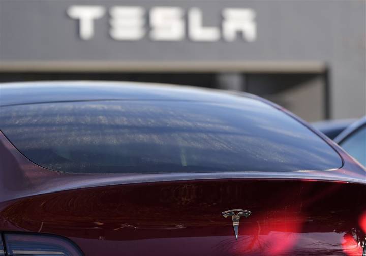 Tesla under investigation after parents say faulty door handles trapped their kids in the back