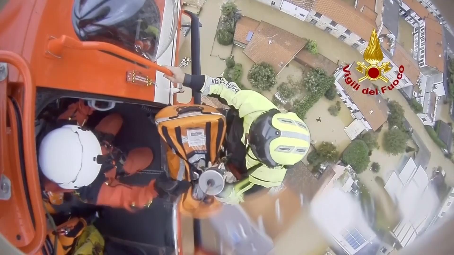 Firefighter helicopter team rescues mother and baby stranded by flood waters in Italy