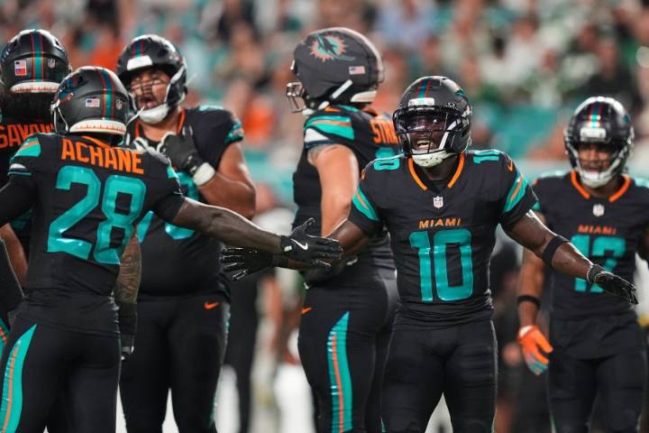Dolphins' Tyreek Hill carted off field and taken to hospital with dislocated left knee