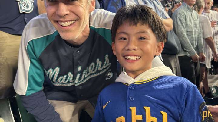 Mariners fan gifts historic ball to young boy : NPR