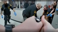 Ohio county agrees to $7M settlement over man's death after jail guards restrained him, family says