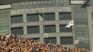 Families affected by childhood cancer experience 'Hawkeye Wave' from inside Kinnick Stadium