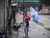 Typhoon Tapah makes landfall in China, prompting mass evacuations, closures