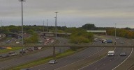 Glasgow M8 travel chaos as lorry crash spills 'load of wood’ across motorway