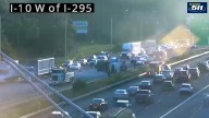 Traffic Alert: Back-ups building after dump truck overturns on I