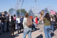 Federal agents fire chemicals as protesters try to block car at immigration site outside Chicago