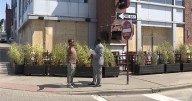 Play Bar and Grill co-owner pushes back after city boards it up following shooting in The Flats