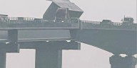 Highway 12 closed after modular home blown off trailer on Oregon Inlet bridge