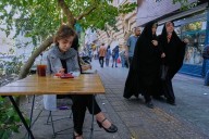 A hungrier, poorer and more anxious Iran awaits 'snapback' of UN sanctions over its nuclear program