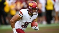 Commanders RB Austin Ekeler carted off vs. Packers with Achilles injury
