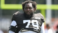 Browns starting tackle out for season with knee injury