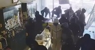 Video shows over a dozen masked robbers raiding California jewelry store