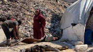 Displaced Palestinians shelter at garbage dumps