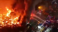 Aerial video shows major fire ripping through homes in Manila