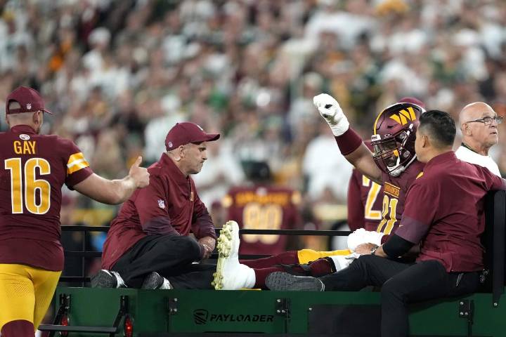 Commanders DE Deatrich Wise Jr. carted off with leg injury during Packers game