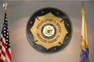 Detective says she was fired after reporting prosecutor’s office misconduct
