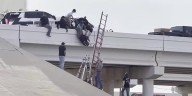 2 deputies seriously injured in crash that left one of them dangling from overpass