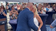 College football fans tie the knot during tailgate wedding