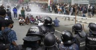 Police in Nepal open fire on protesters, killing 11