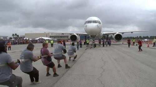 Teams pull 124K-pound jet in Long Beach to raise money for Special Olympics Southern California athletes