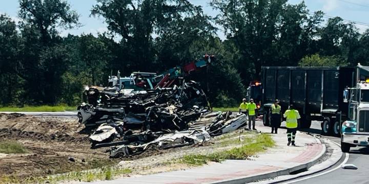 Semi-truck carrying junk cars flips, spills gas on roundabout near Hyundai plant entrance