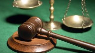 Ex-police recruit sentenced to 9 years for cyberstalking, child porn charges