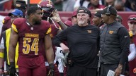 Commanders’ Dan Quinn bloodies nose after collision on sideline
