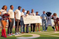 Texans’  Cal McNair, Hannah McNair, Andre Johnson, Mike Tomon visit Kerrville, give donations after flooding tragedy