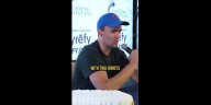 Charlie Kirk is shown describing his favorite Starbucks drink to a young attendee at event