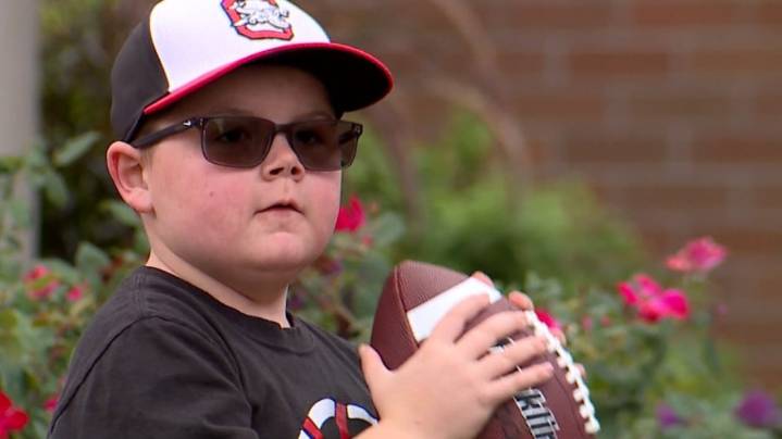Ohio boy with rare genetic disorder throws first pitch at Akron Rubber Ducks game