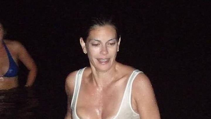 Teri Hatcher, 60, strips down to her underwear and goes braless under wet white tank top during late