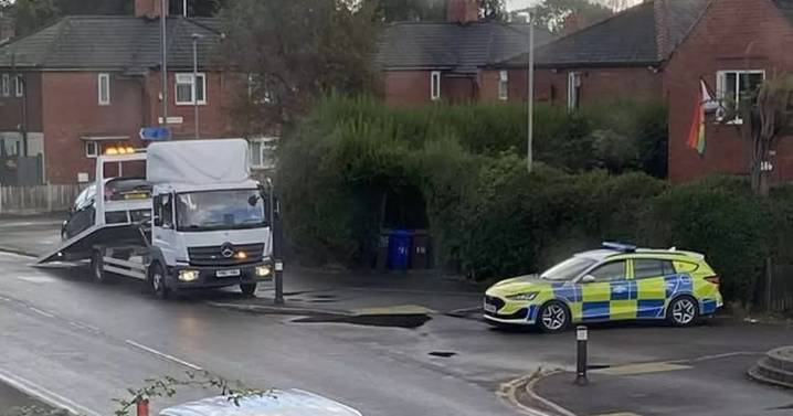 Police close road after man 'struck by car' in south Manchester