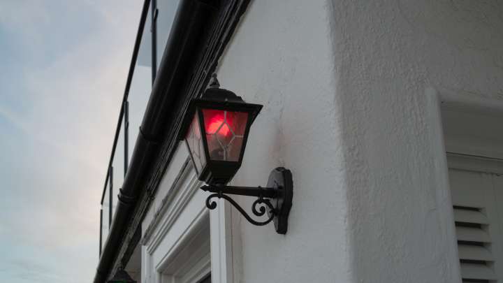What It Means If You See A Home With A Red Porch Light