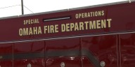 Crews fight fire in car lot in south