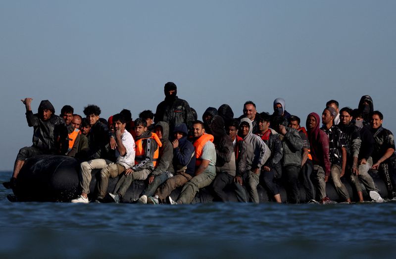 Britain suspends refugees' family reunion applications to toughen rules