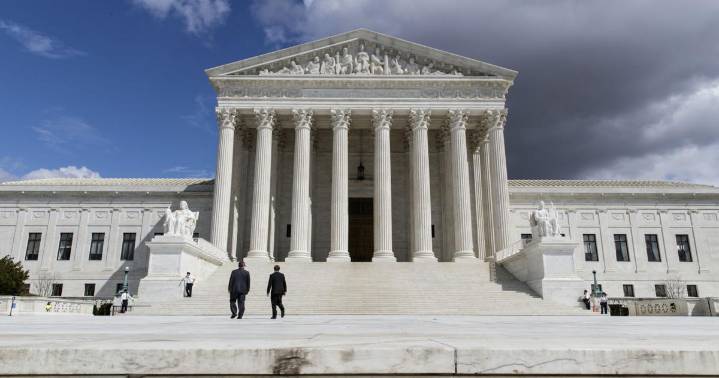Trump says US would be on 'brink of economic catastrophe' unless justices rule his tariffs are legal