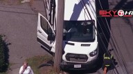 Crews respond after van hits utility pole in Peabody