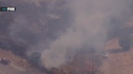 Deadly car fire ignites brush fire along 5 Freeway
