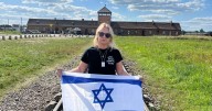 Jewish educator harassed at Auschwitz for holding Israeli flag