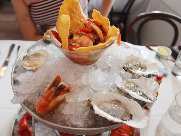 I dined at Dock's Oyster House, a 128-year-old seafood restaurant. The $47 seafood tower was worth every dollar.