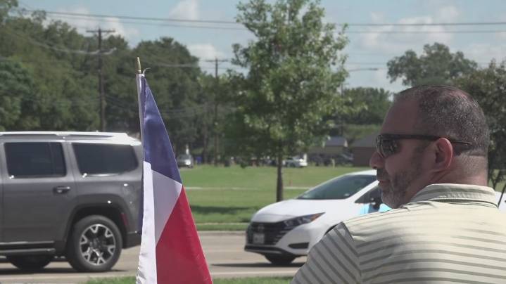 Protesters gather outside McLane Stadium during Abbott's State of the State Address